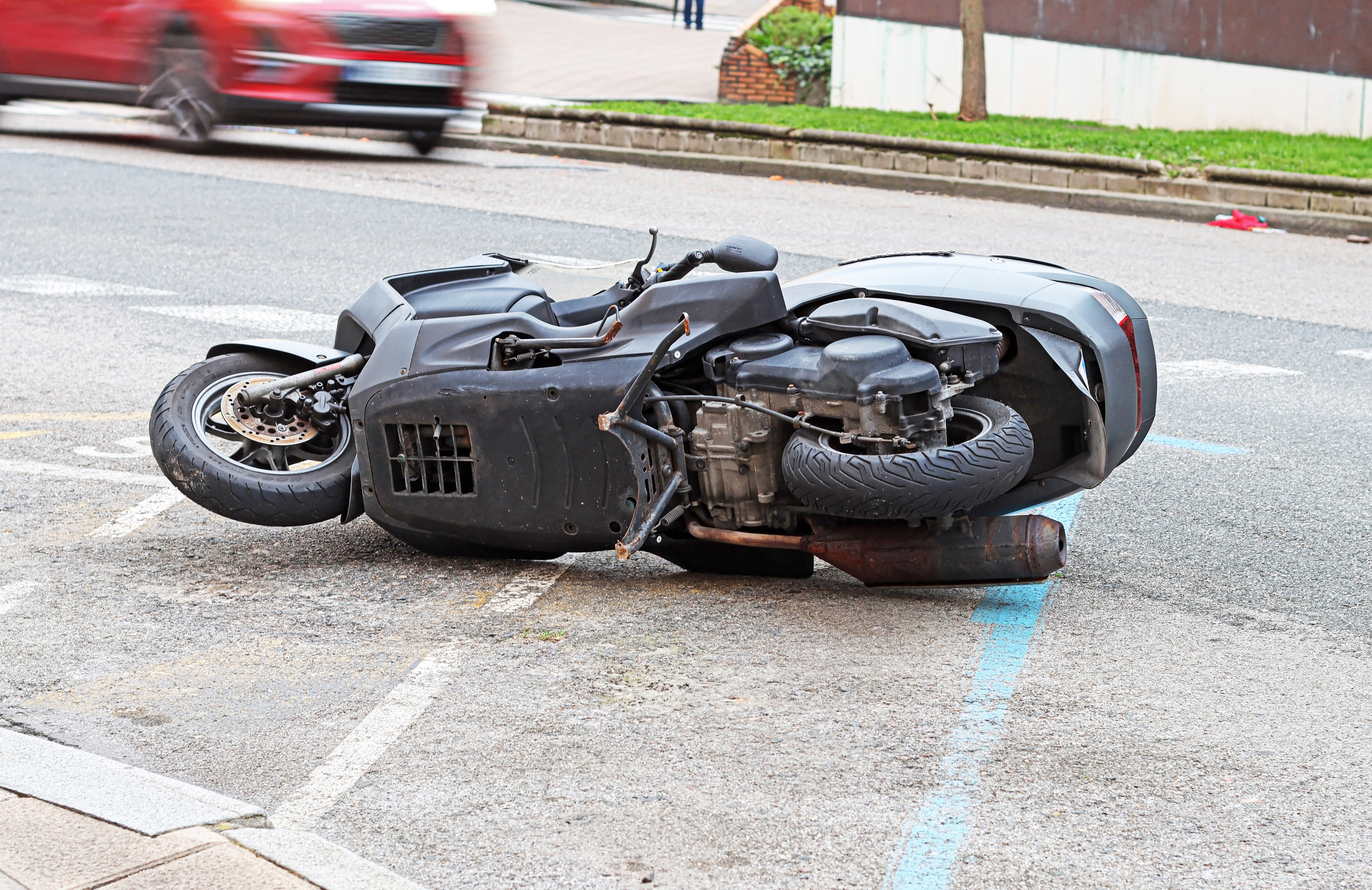motorcycle overturned in a parking lot after a motorcycle accident