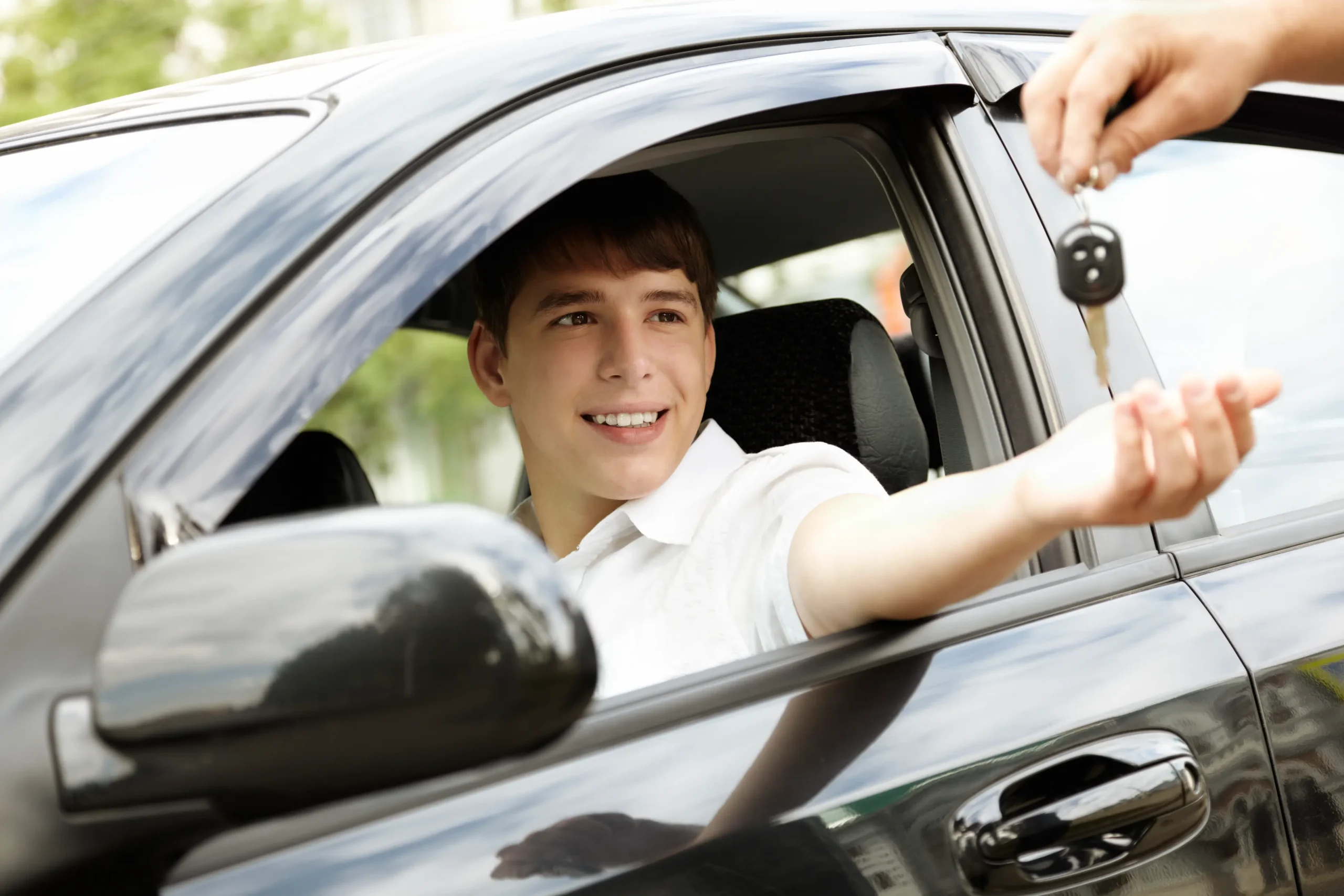 teen driver getting keys to his first car